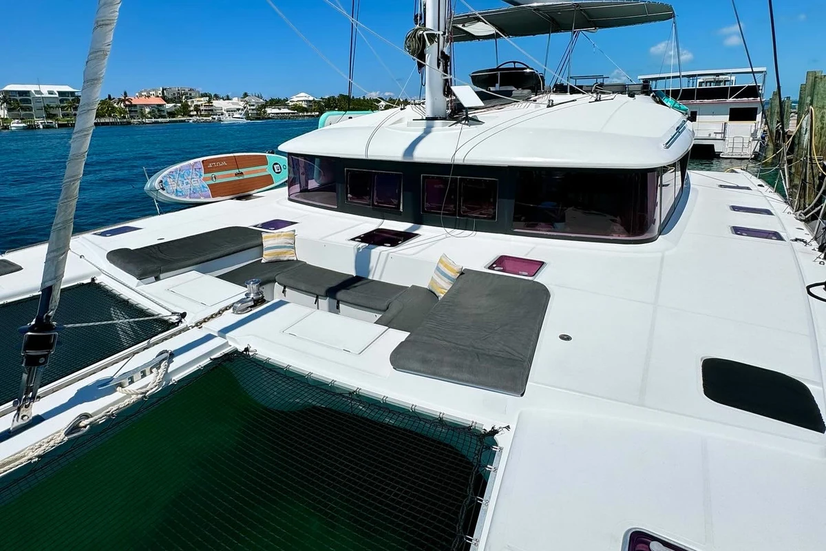 Outdoor dining setup on deck of 56 ft Lagoon Nassau yacht Miami