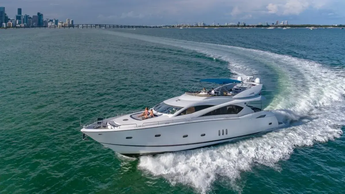 Outdoor dining setup on deck of 84 ft Sunseeker yacht Miami
