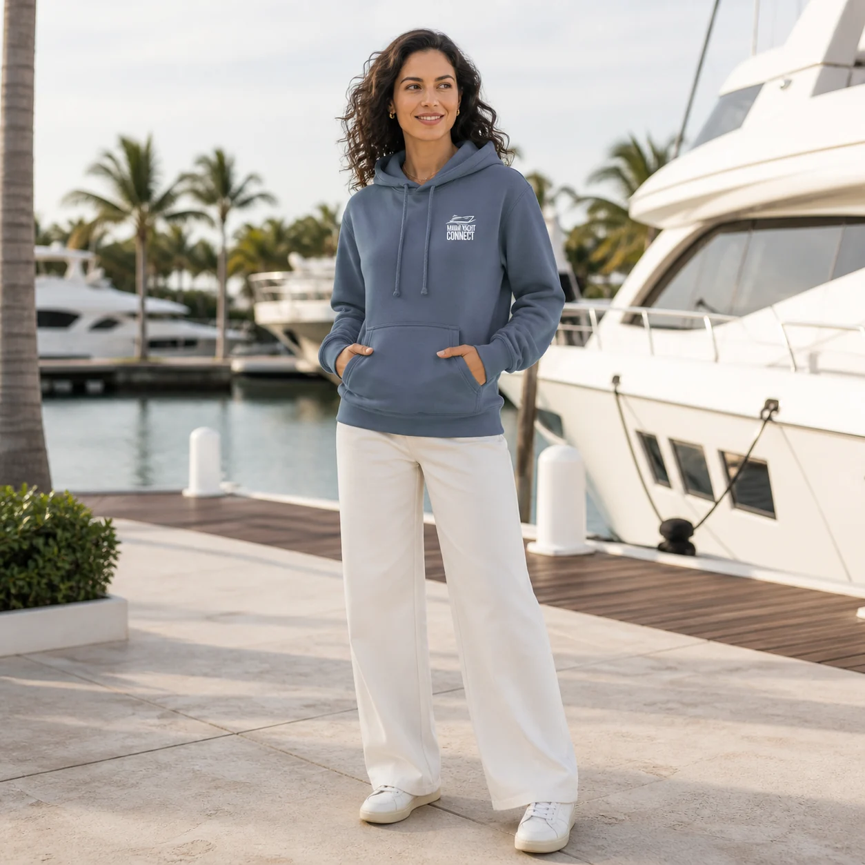 The slate blue You're Gonna Need A Bigger Boat hoodie worn on a yacht in Miami