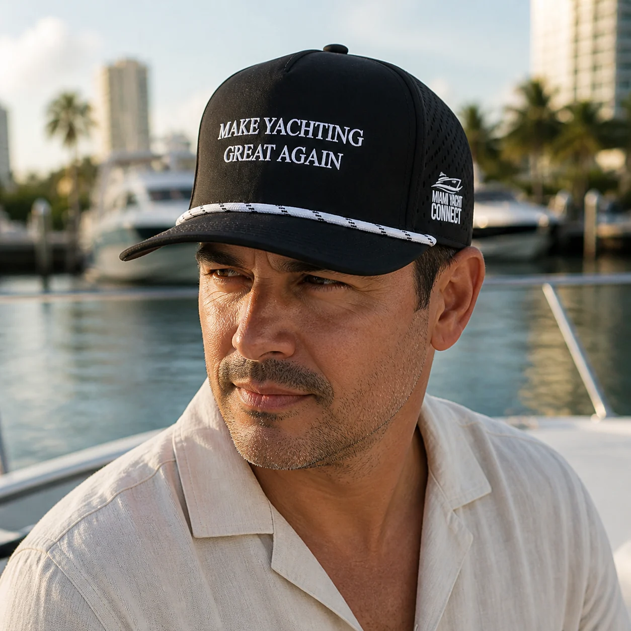 The black Make Yachting Great Again cap worn on a yacht in Miami