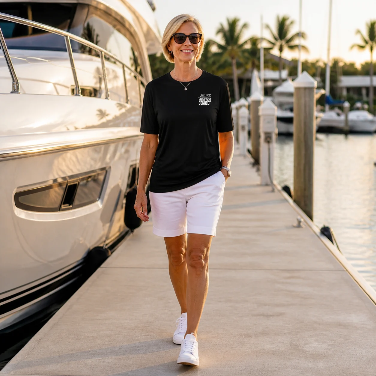 The black No Crying On The Yacht t-shirt worn on a yacht in Miami