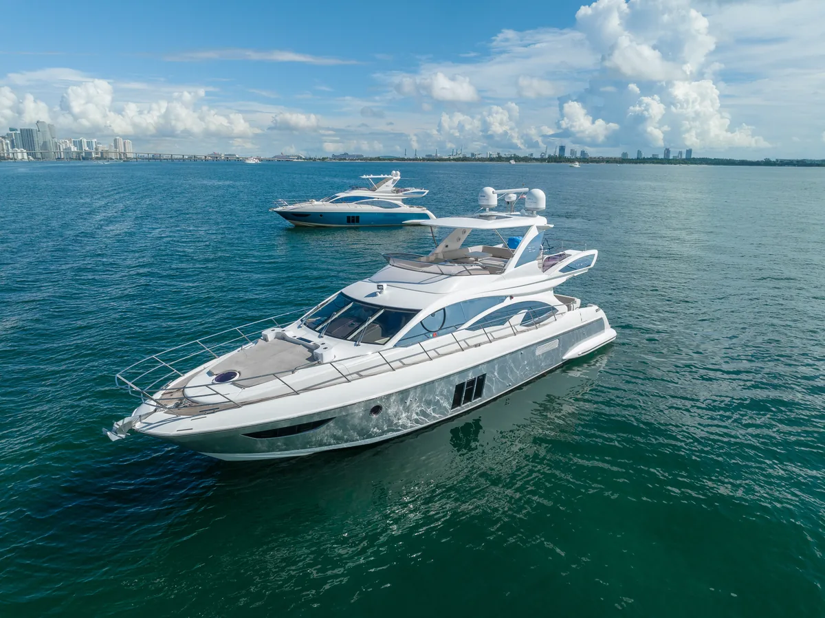 Outdoor dining setup on deck of 60 ft Azimut S yacht Miami
