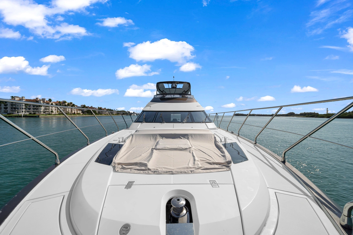Outdoor dining setup on deck of 66 ft Marquis yacht Miami
