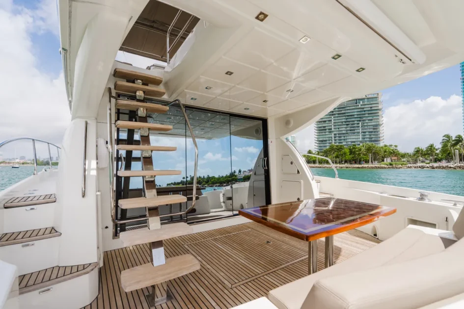 Outdoor dining setup on deck of 65 ft Prestige yacht Miami